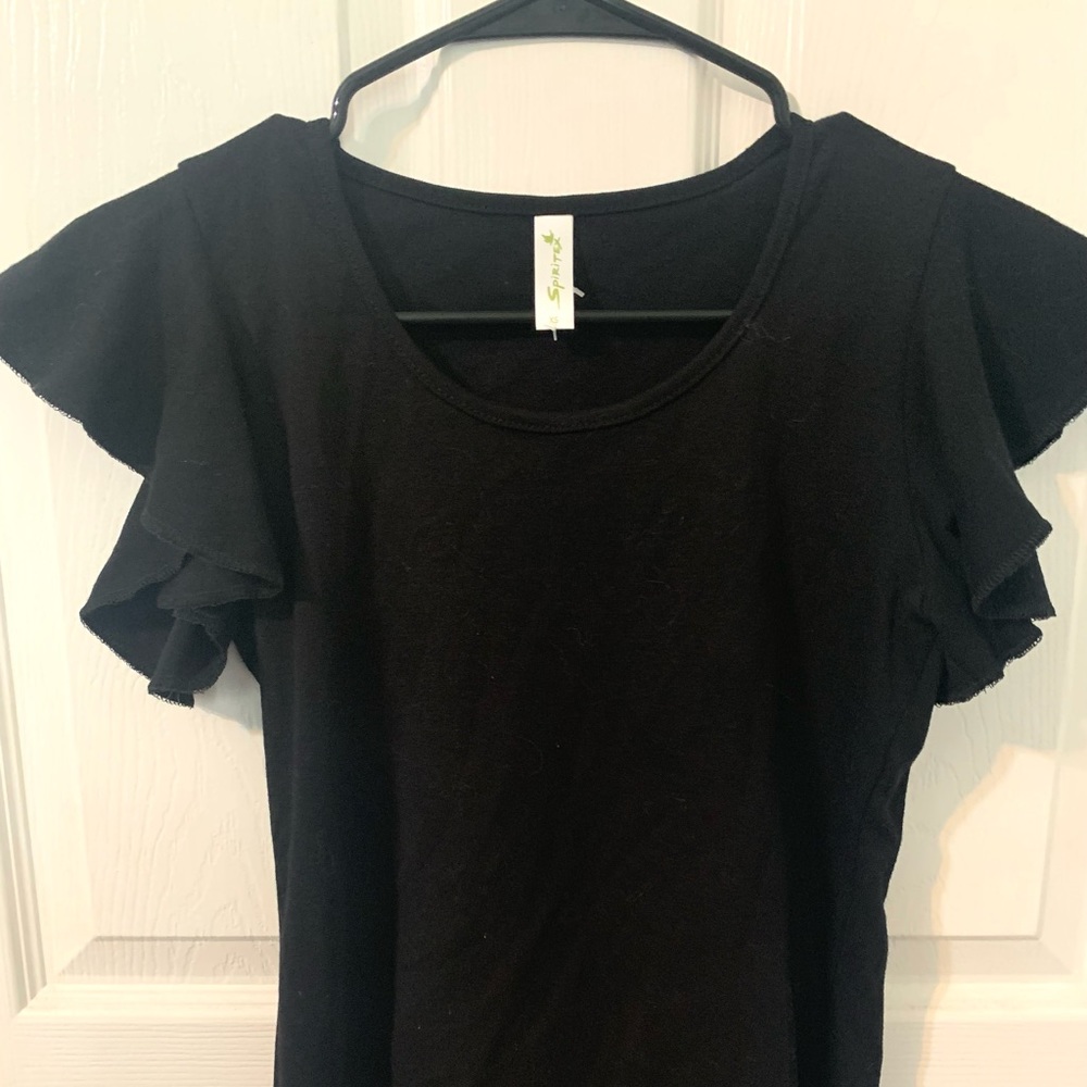 This is a ruffle sleeved shirt. Selling because it wasn’t my style.